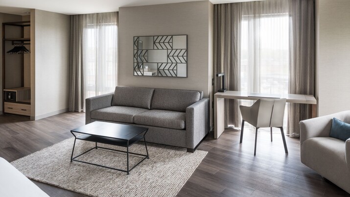 Living area with couch, desk and chair.