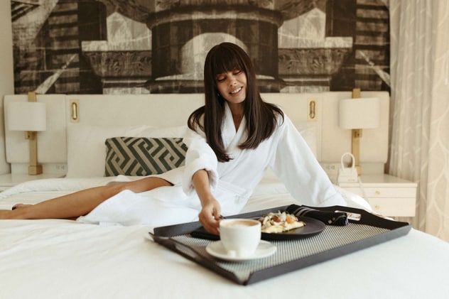 A woman having breakfast in bed