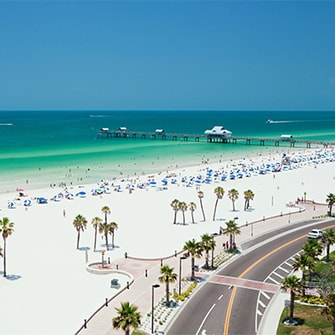 White sand beach in Florida with vacationers.