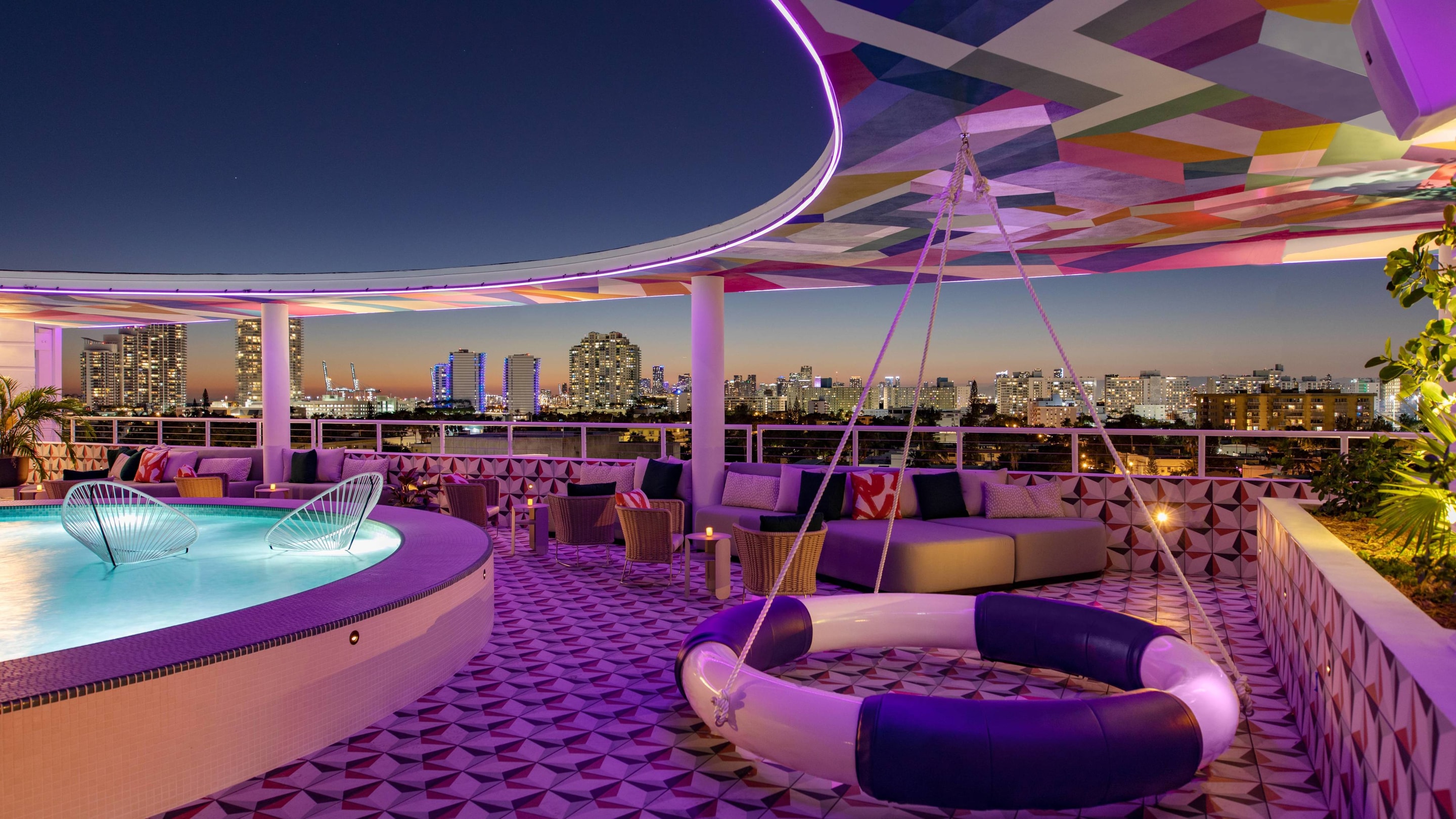 The upside rooftop bar and lounge area with colorful design and fun seating