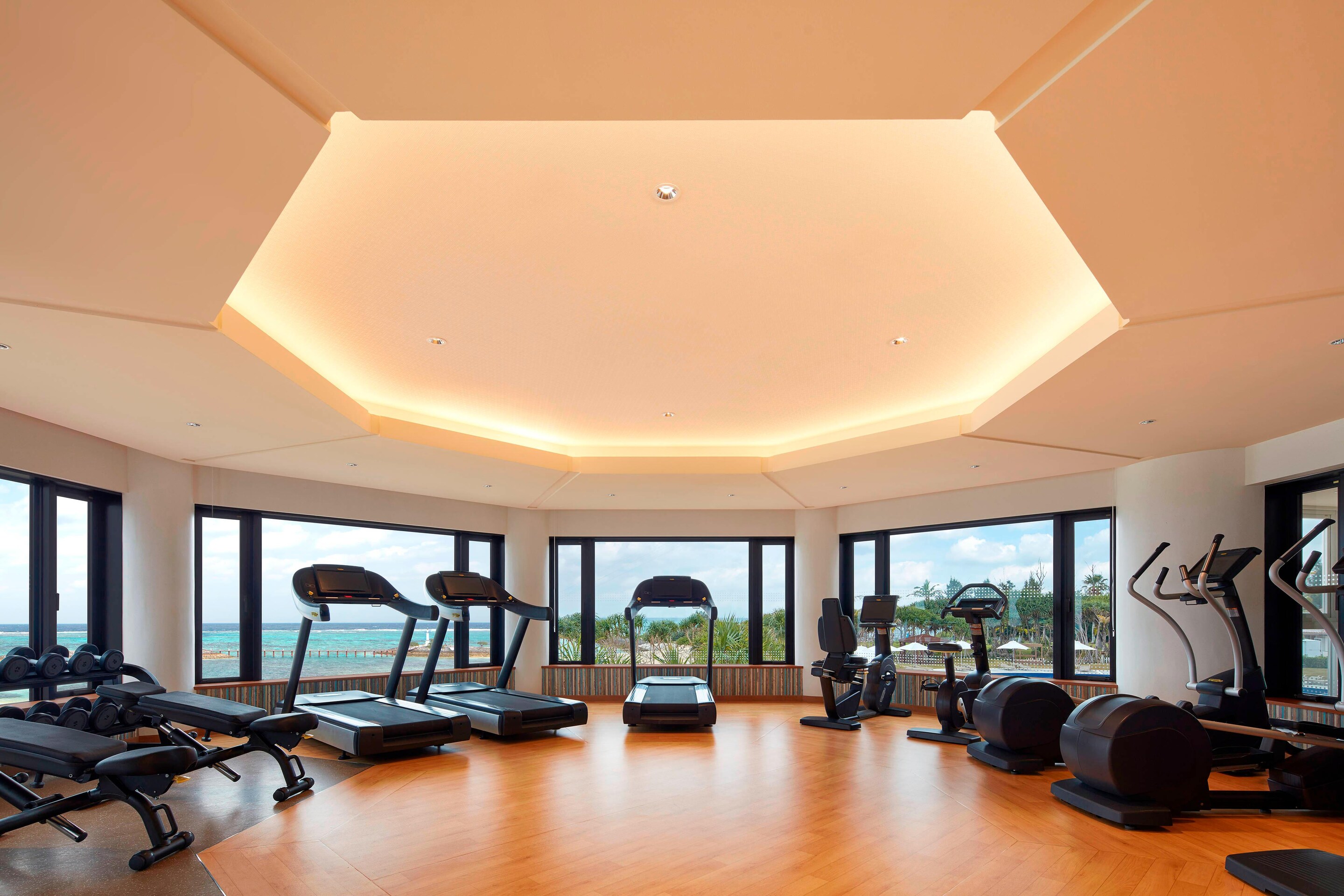 Fitness center with windows and exercise equipment