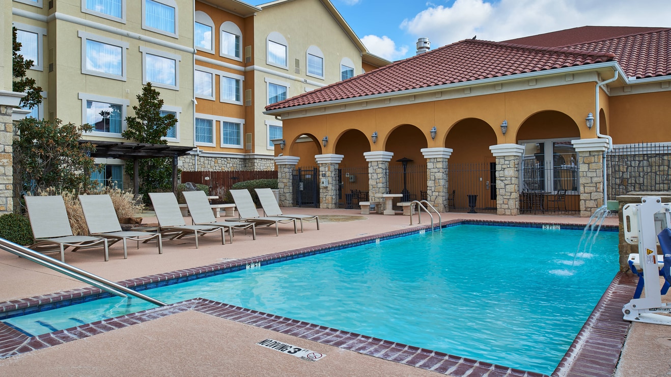 Abilene Texas outdoor pool with lounge chairs 