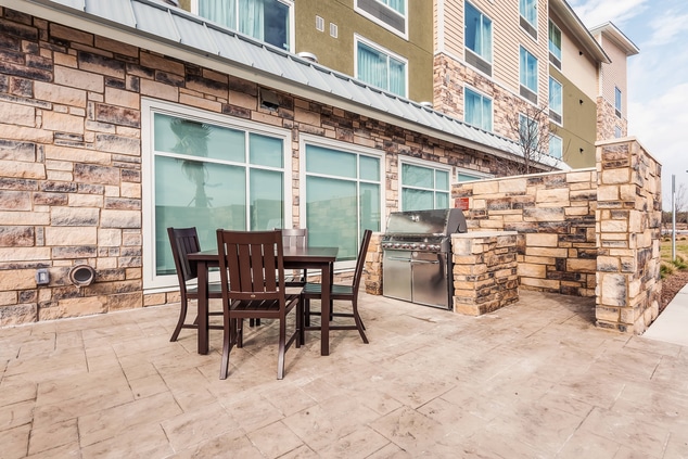 Outdoor patio with grill for hotel guest use