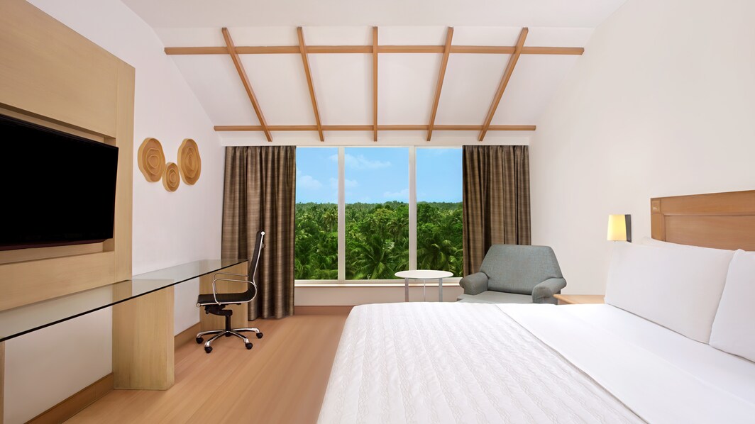 Chambre Deluxe avec lit king size et vue sur le marais