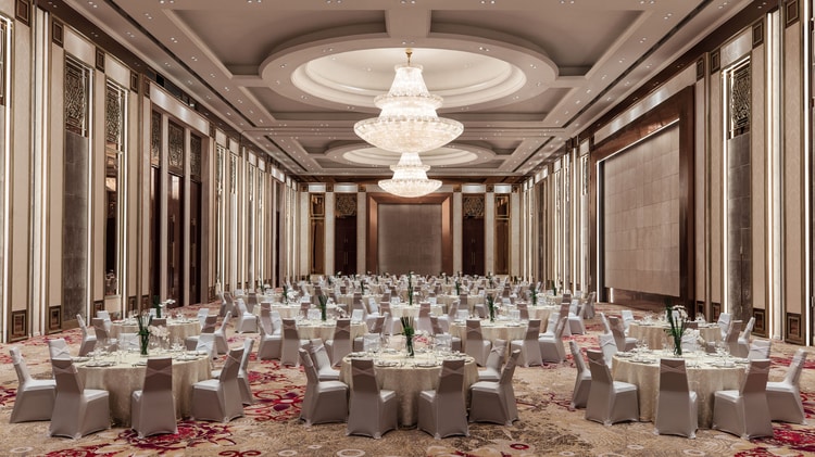 Grand Ballroom filled with table set for a formal dinner.