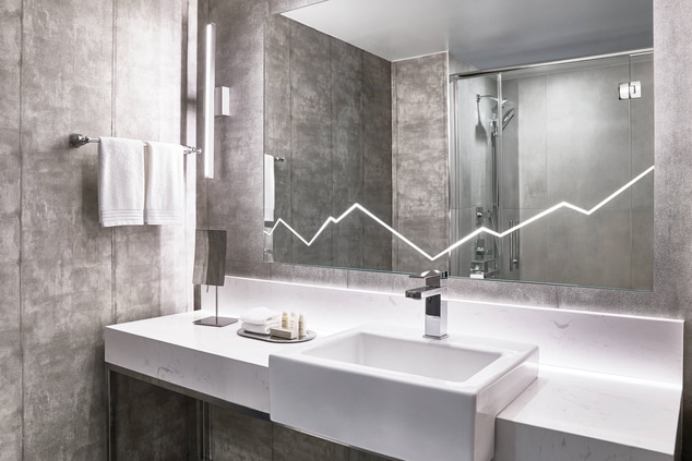 Bathroom vanity showing walk-in shower