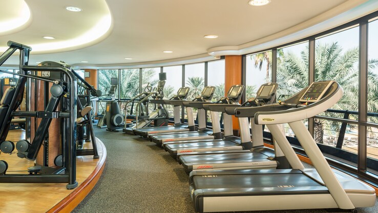 Fitness room with workout equipment.