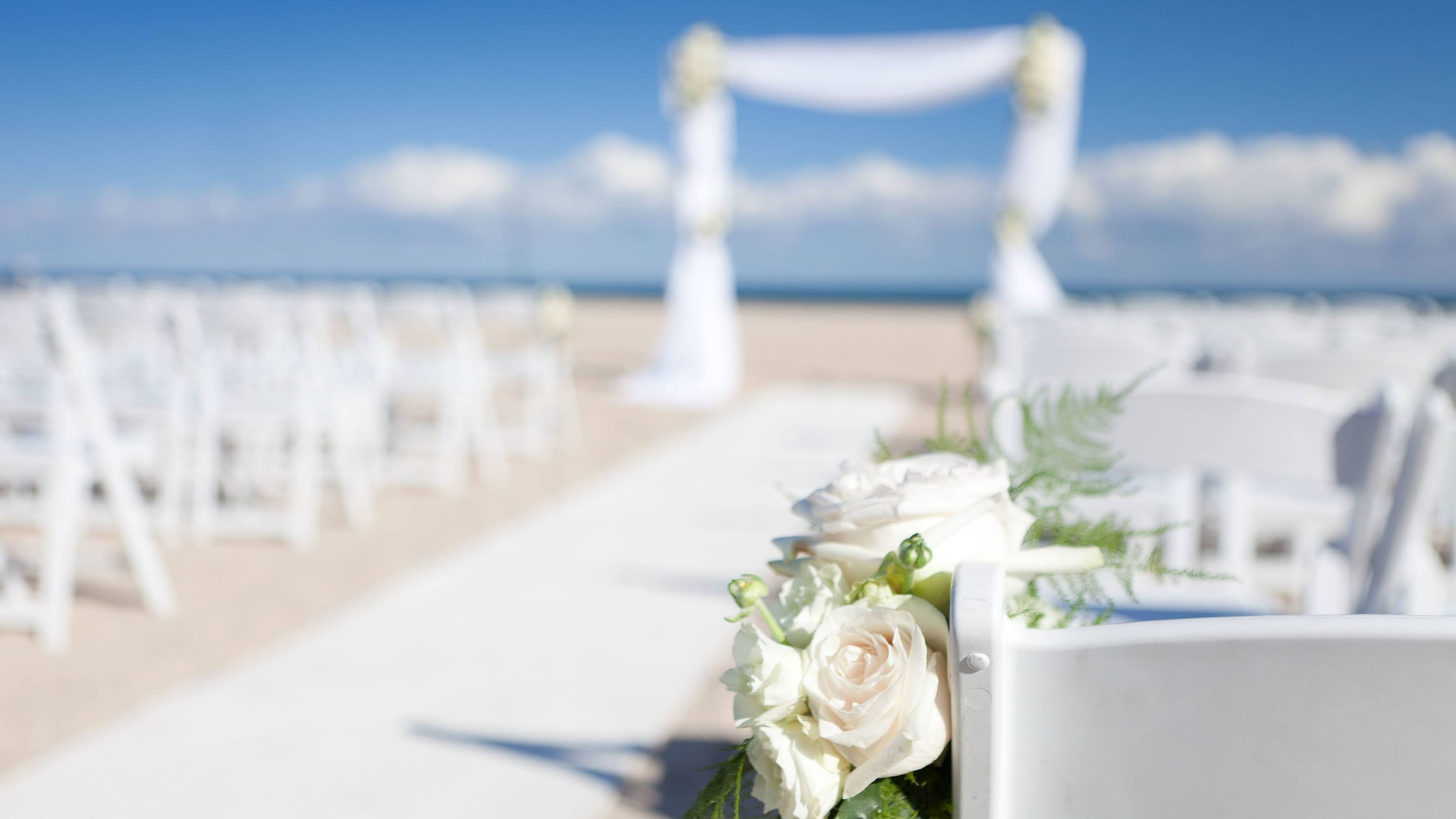 Beach wedding ceremony sey.