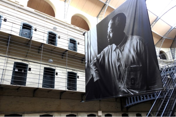 Large portrait of Nelson Mandela inside former prison