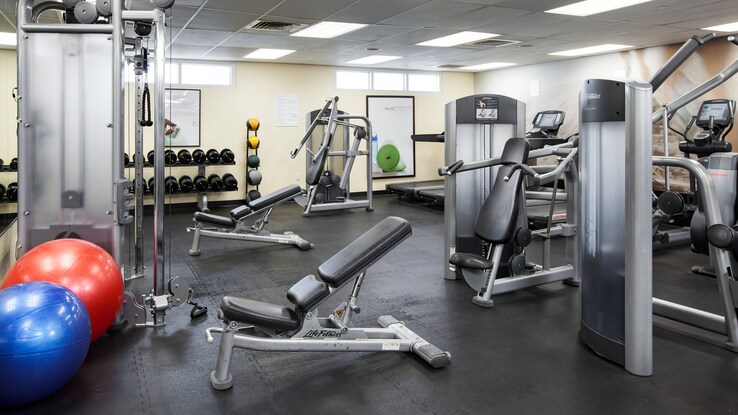 Fitness Studio with equipment and weights.
