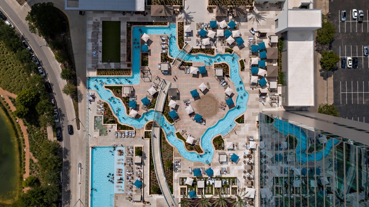 Aerial view of rooftop lazy river in the shape of the state of Texas.