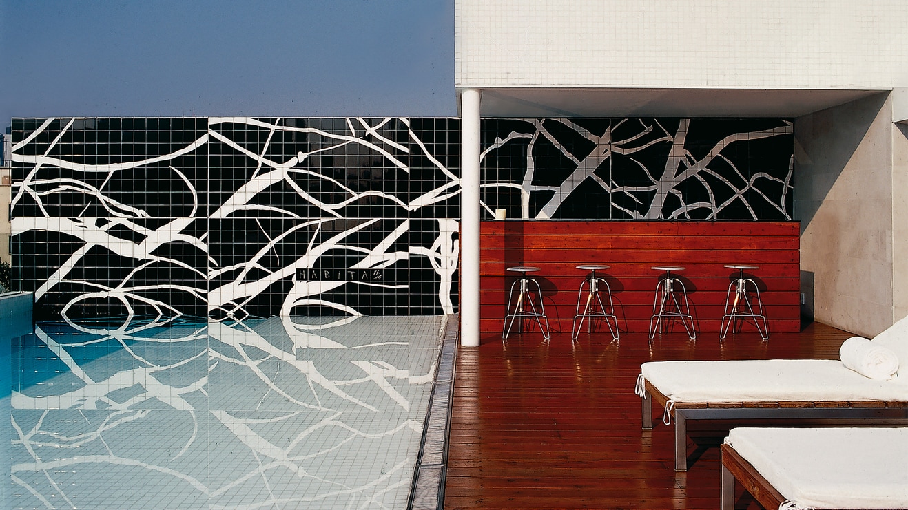Sun Loungers and Bar on the Rooftop Pool