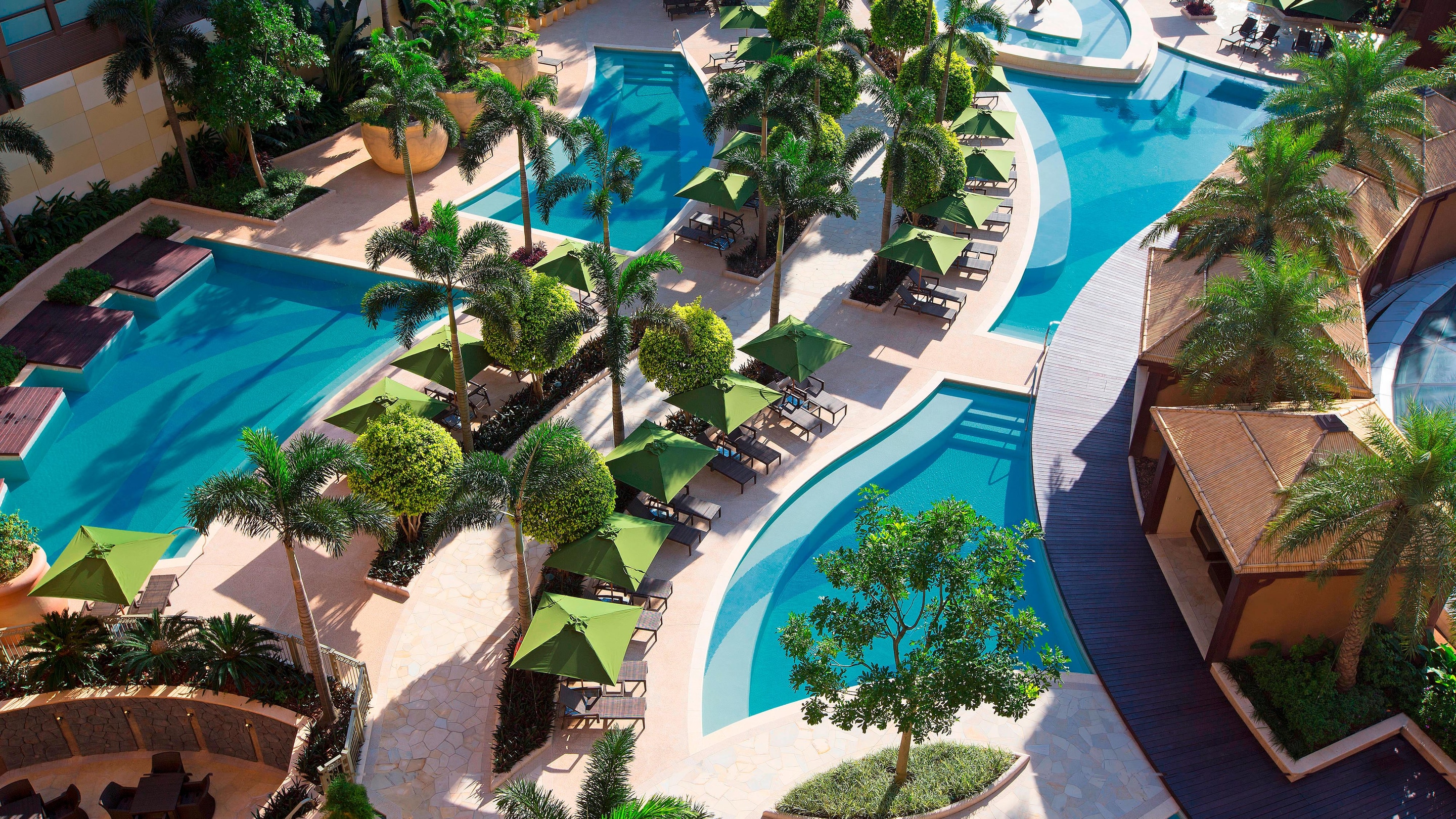 Aerial view of swimming pools, cabanas and foliage