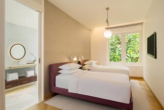 Duplex Poolvilla am Strand – Schlafzimmer mit zwei Einzelbetten