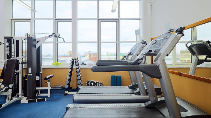 Fitness gym with treadmills and weight machine. 