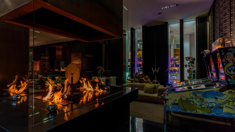 Lounge area with indoor firepits and arcade games.