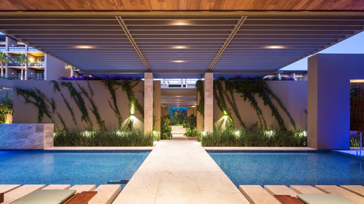 Path going over indoor pool leading to spa.