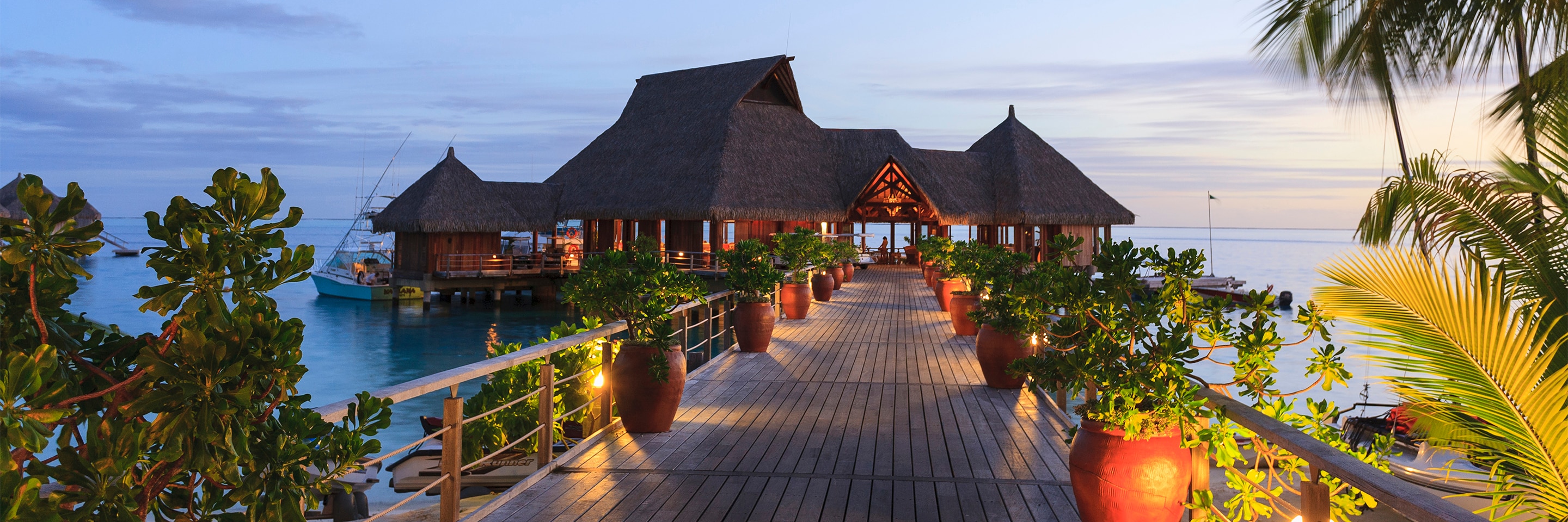 Luxury hotel and restaurant situated on a tropical ocean.