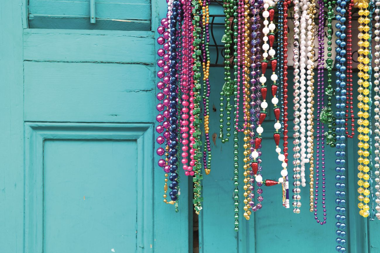 Strings of colorful beads hanging on a door