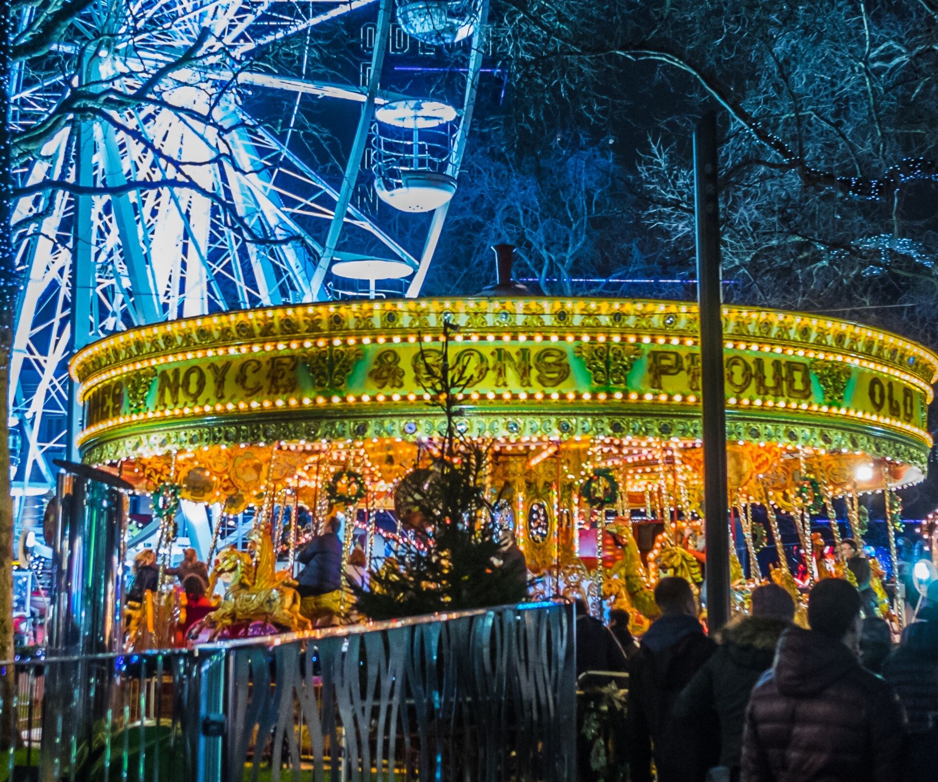 Editorial, Beautiful, Tourism, Building Exterior, Fame, Merry-Go-Round, Ornate, Lighting Equipment, Soho - London, Leicester Square, Oxford Street, Regent Street, London - England, Shopping, Traffic, Street Light, Movie Theater, Fun, Beauty, Carousel, Ferris Wheel, Illuminated, Multi Colored, Crowded, International Landmark, Travel Destinations, Retail, Outdoors, Crowd, Tourist, People, England, UK, Winter, Rain, Decoration, Store, Street, Built Structure, Traveling Carnival, Christmas, Umbrella, Star Wars, New Year