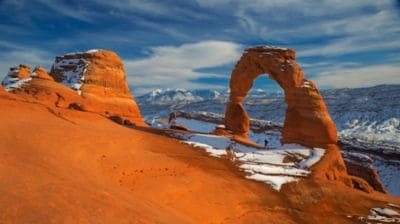 arches, west, western, hike, red rocks, la sal, mountains, person, formation, blue sky, clouds, silhouette
