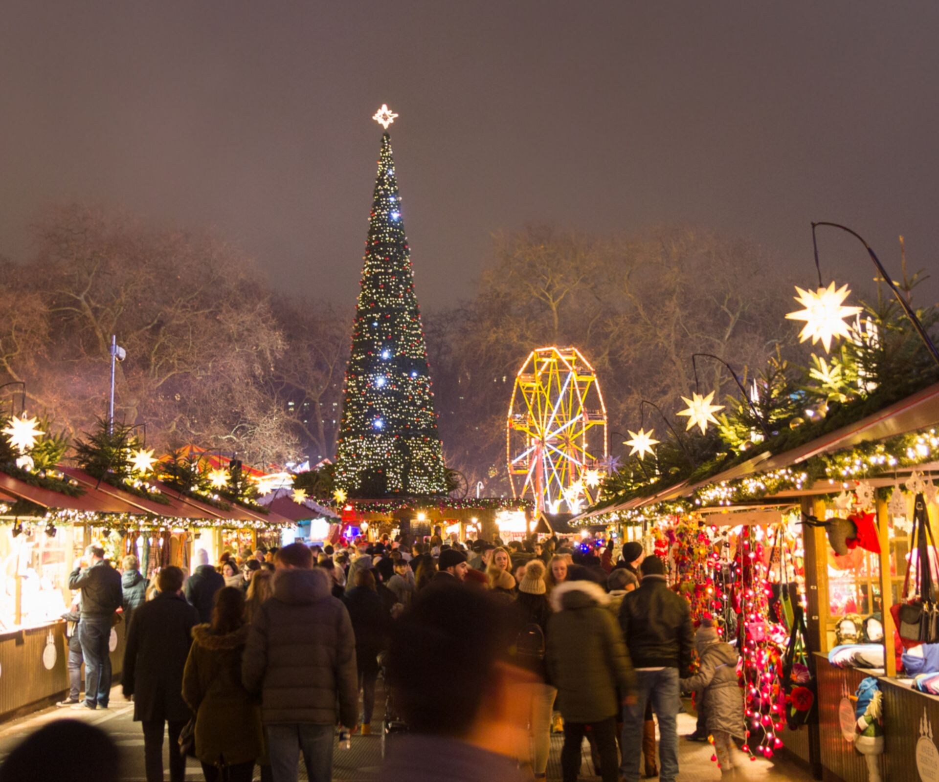 Christmas Market, European Culture, Retro Styled, Travel, Tourism, Holiday, Celebration, Candy Store, Clothing Store, Toy Store, Antique Shop, Dusk, Delicatessen, Mayfair, Hyde Park - London, London - England, Wheel, Illuminated, Happiness, Humor, Shiny, Old-fashioned, Modern, New, English Culture, British Culture, Cultures, Business, Travel Destinations, Vacations, Retail, Urban Scene, Outdoors, Cheerful, People, England, Europe, Tree, Night, Winter, Season, Decoration, Street Market, Market, Store, Park - Man Made Space, Cityscape, City, Town, Christmas, Traditional Festival, winter wonderland, December, Christmas Tree Lot, Boutique