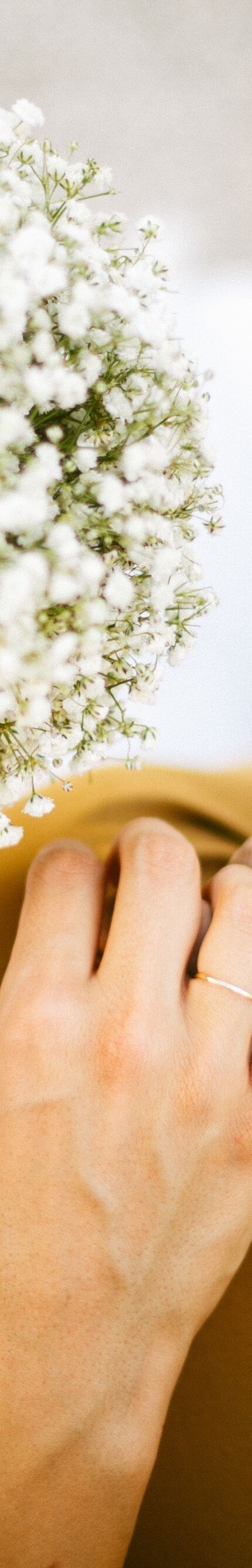 Bride and groom holding their hands together