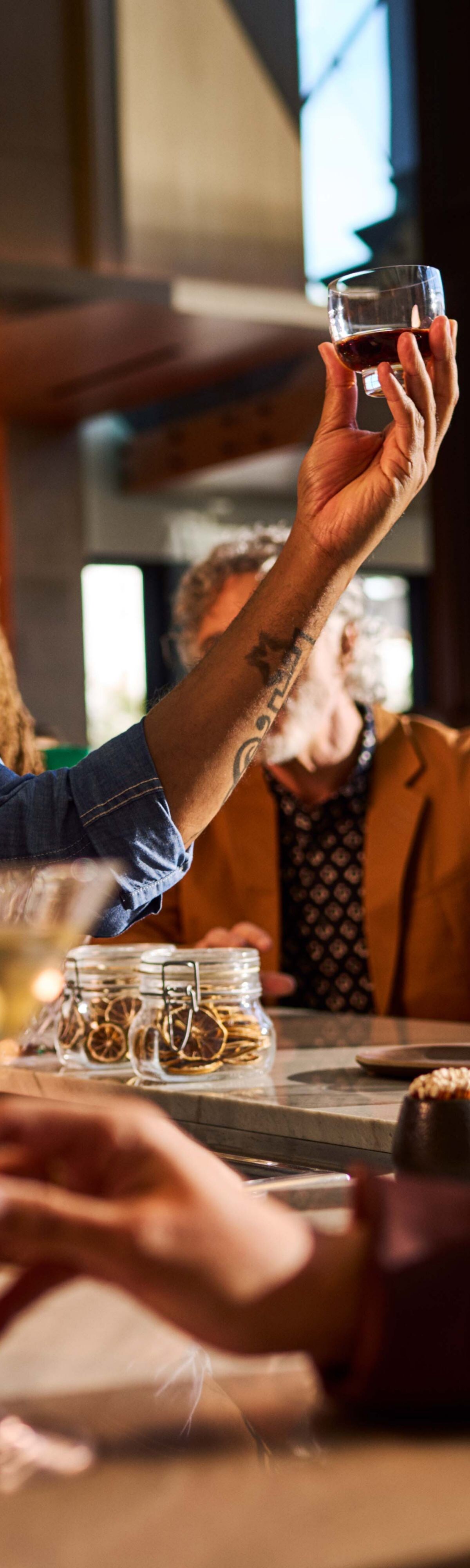 Bartender serving a flight of drinks