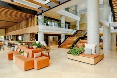 Spacious hotel lobby with seating and stairs