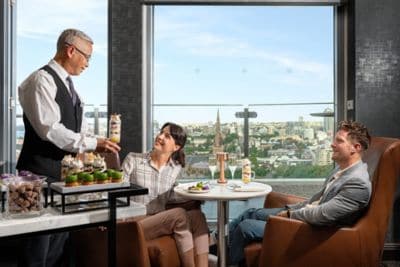 A couple being served in the Sheraton Club