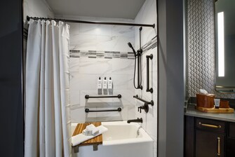 ADA Bathroom with an accessible tub and bench.