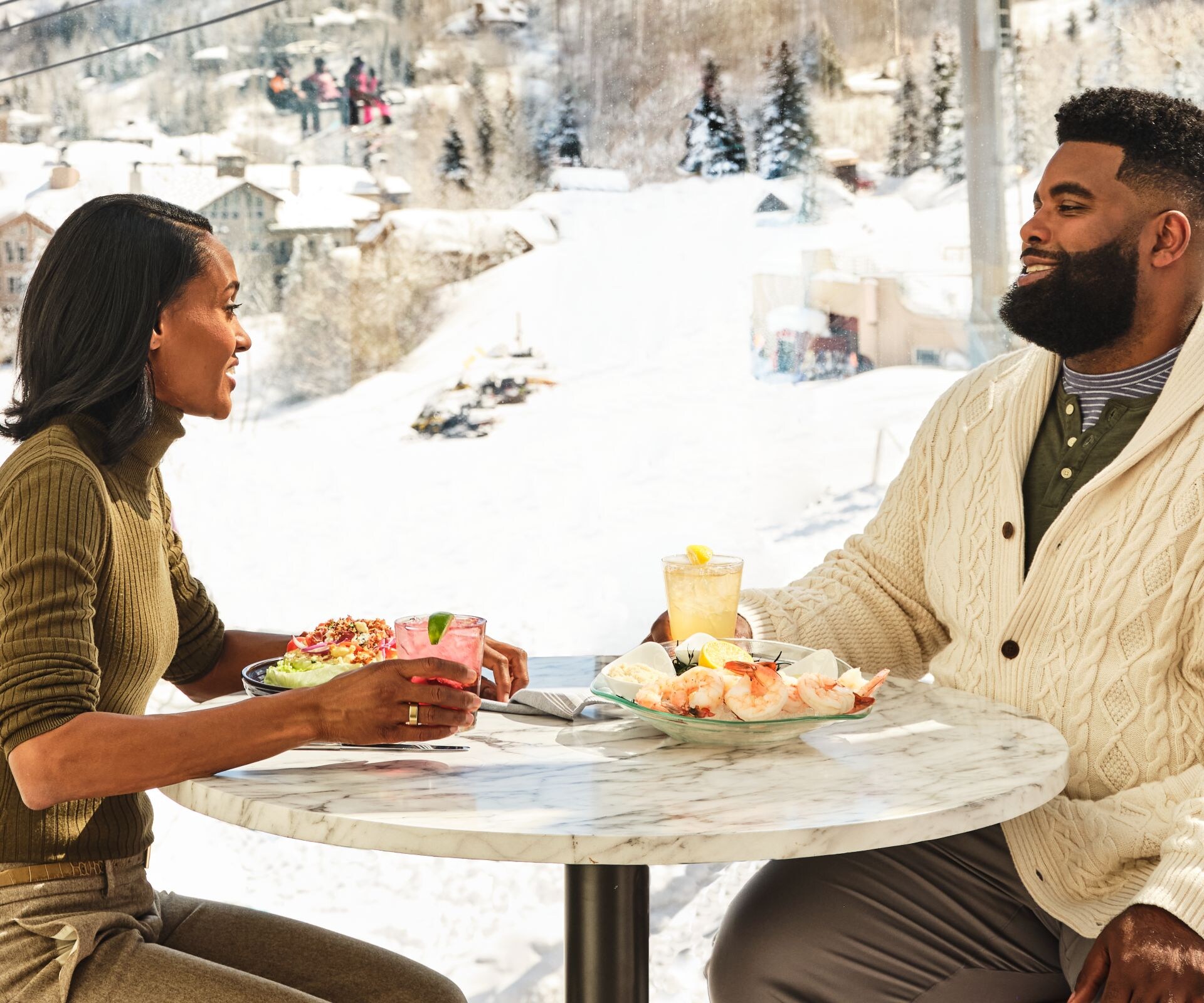 Couple dining with mountain ski view