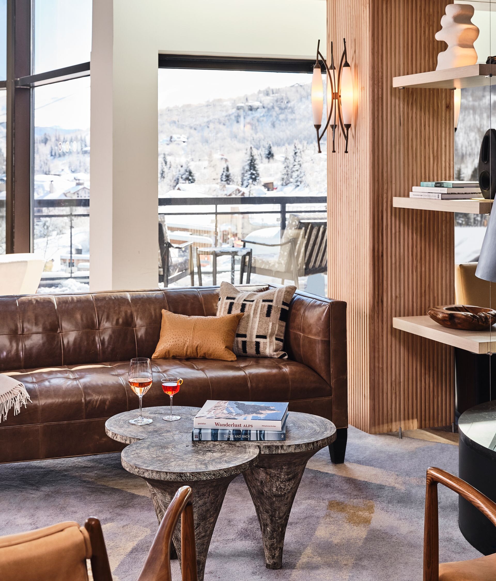Lobby with fireplace and mountain views