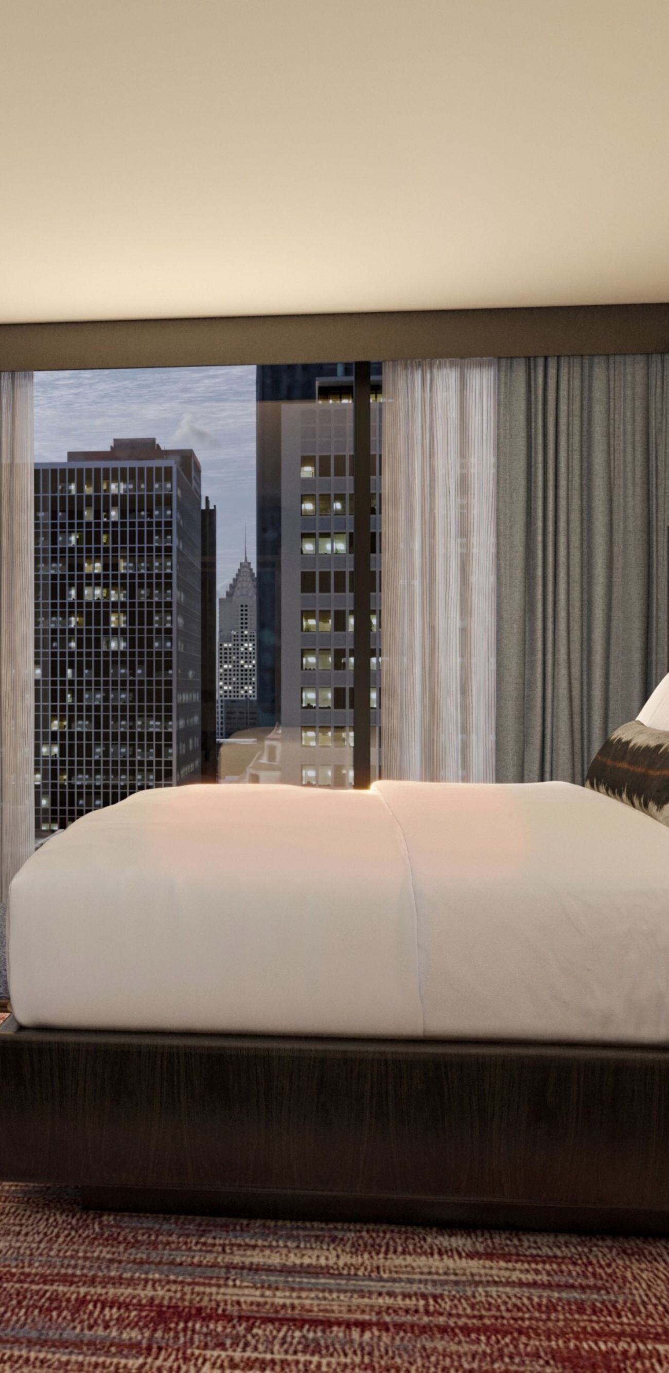King bedroom with city view and tv on wall