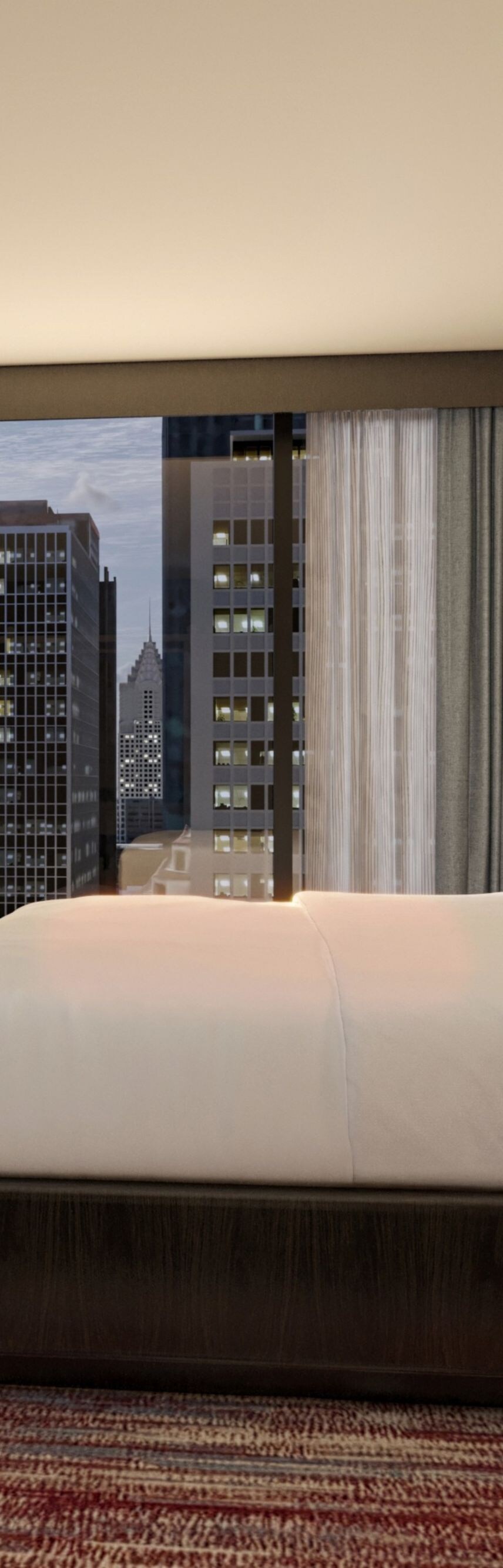 King bedroom with city view and tv on wall