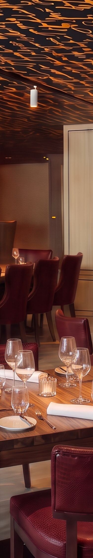 Restaurant with red chairs and script ceiling