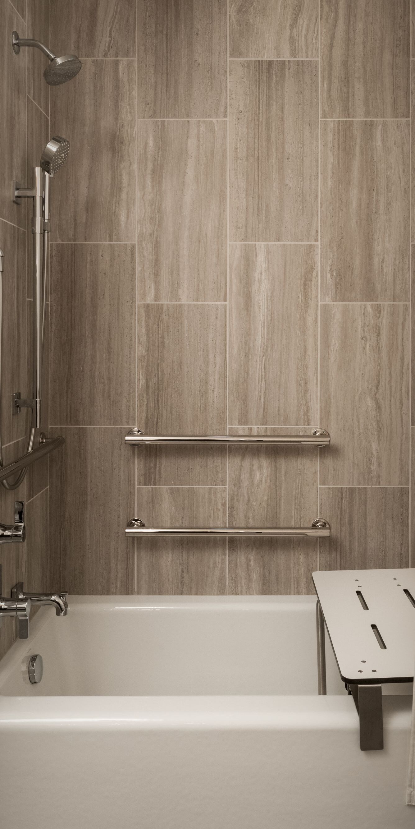 Accessible tub with shower seat and grab bars