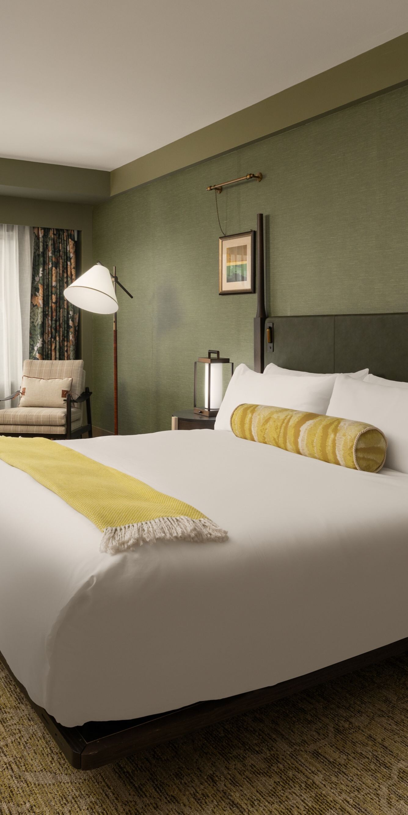 Guest room with king bed and sitting area