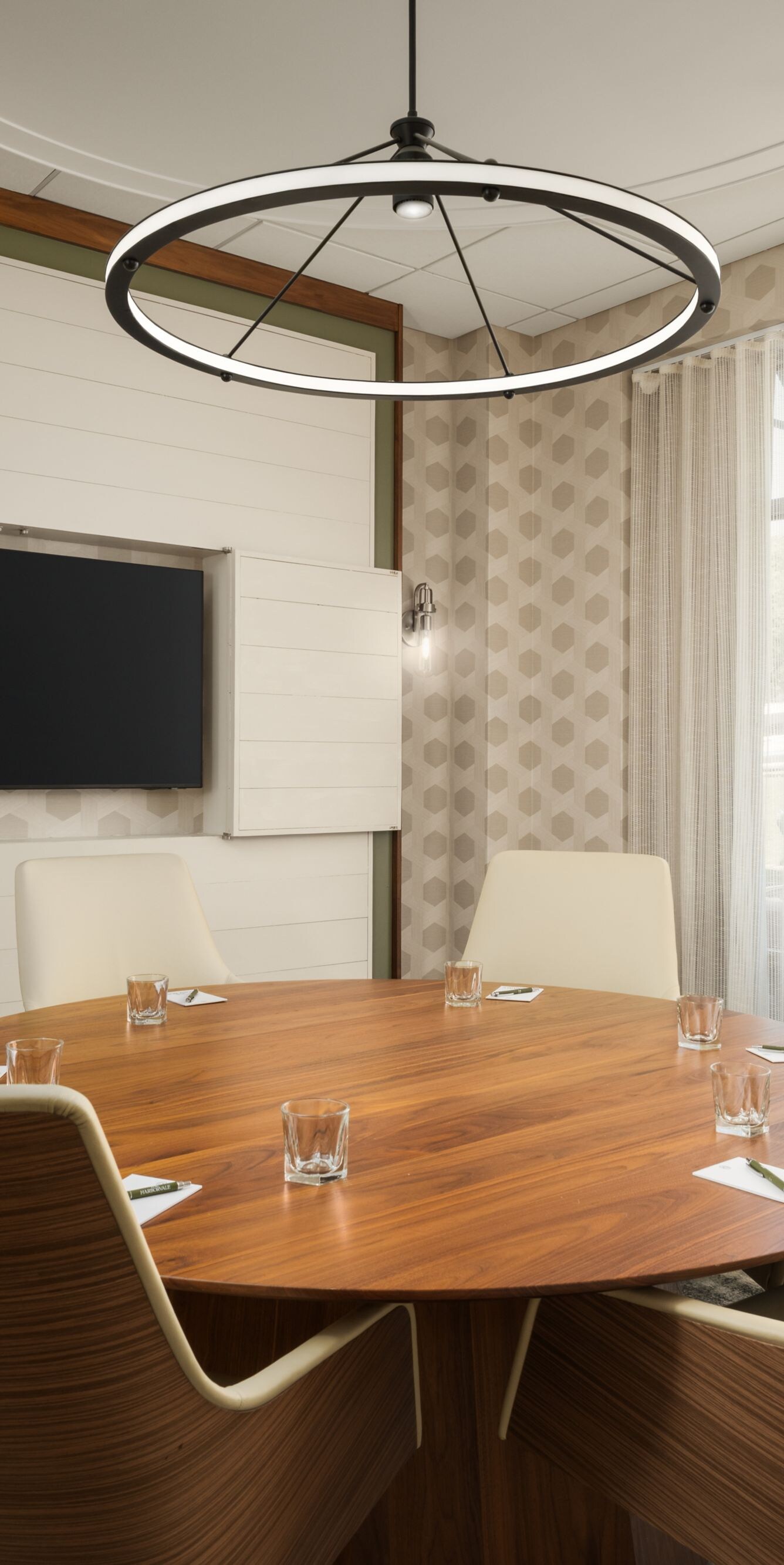 Small round table meeting room with television