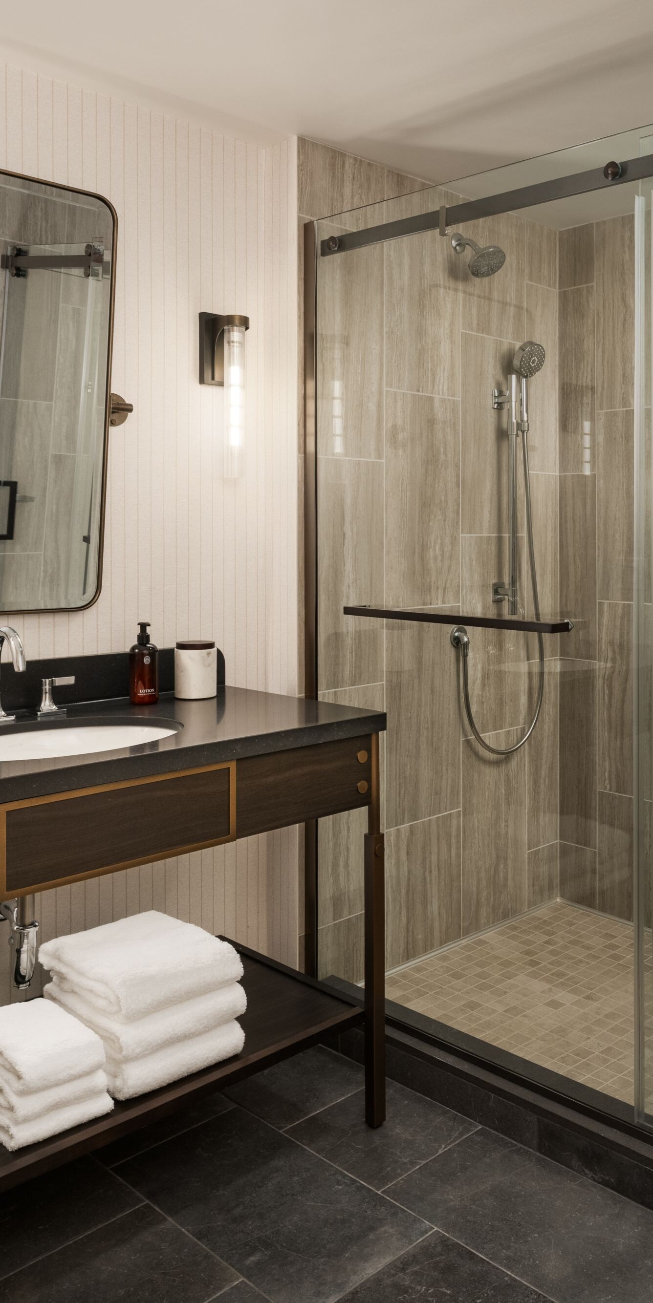 Large sliding glass door shower, vanity and mirror