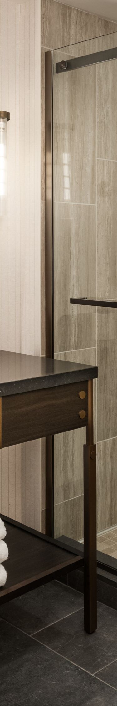 Large sliding glass door shower, vanity and mirror