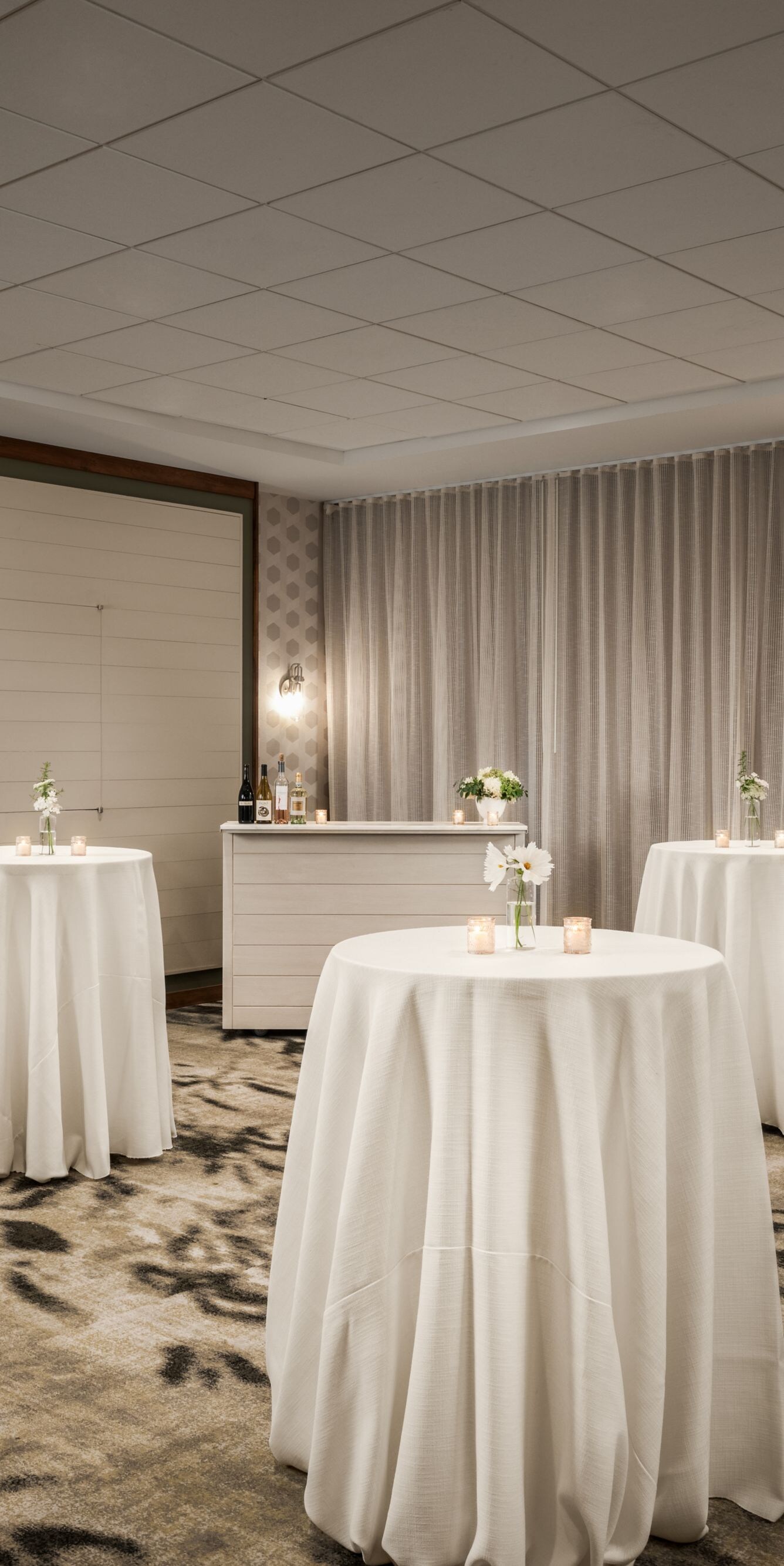 cocktail tables with white linens