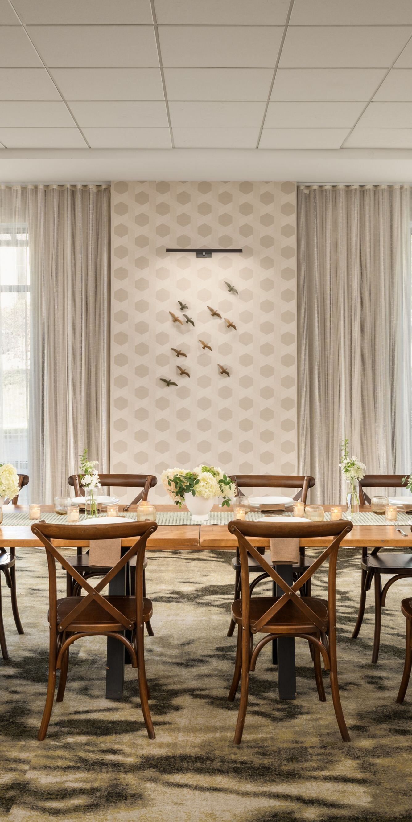 meeting room set up for 12 person dinner 
