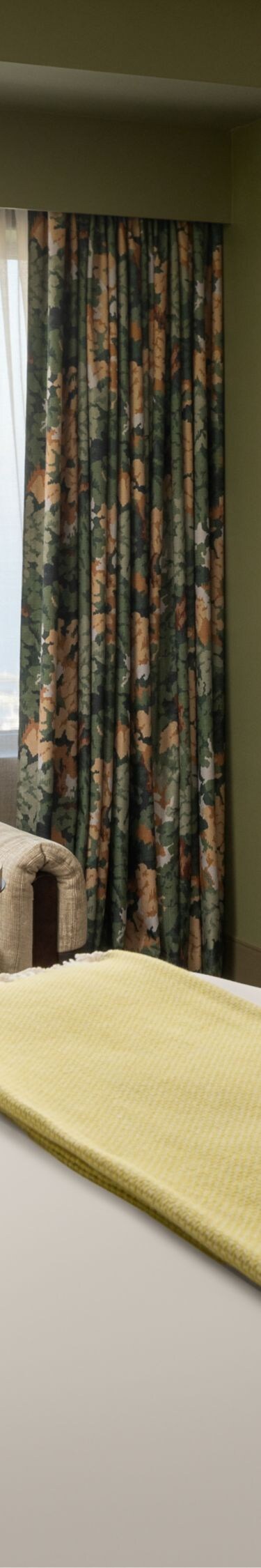 King guest room with couch and lake view