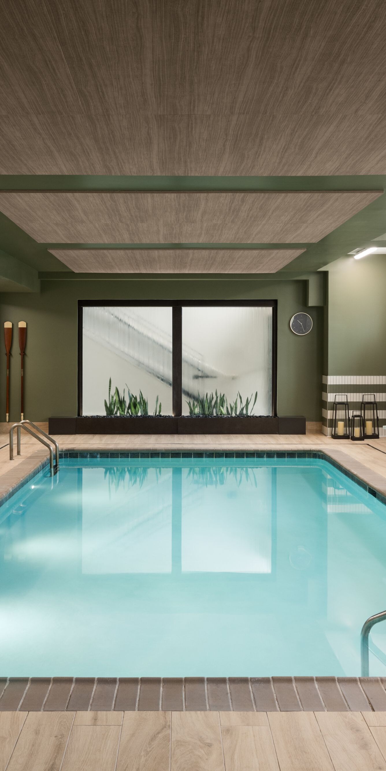 Indoor pool with seating and water feature