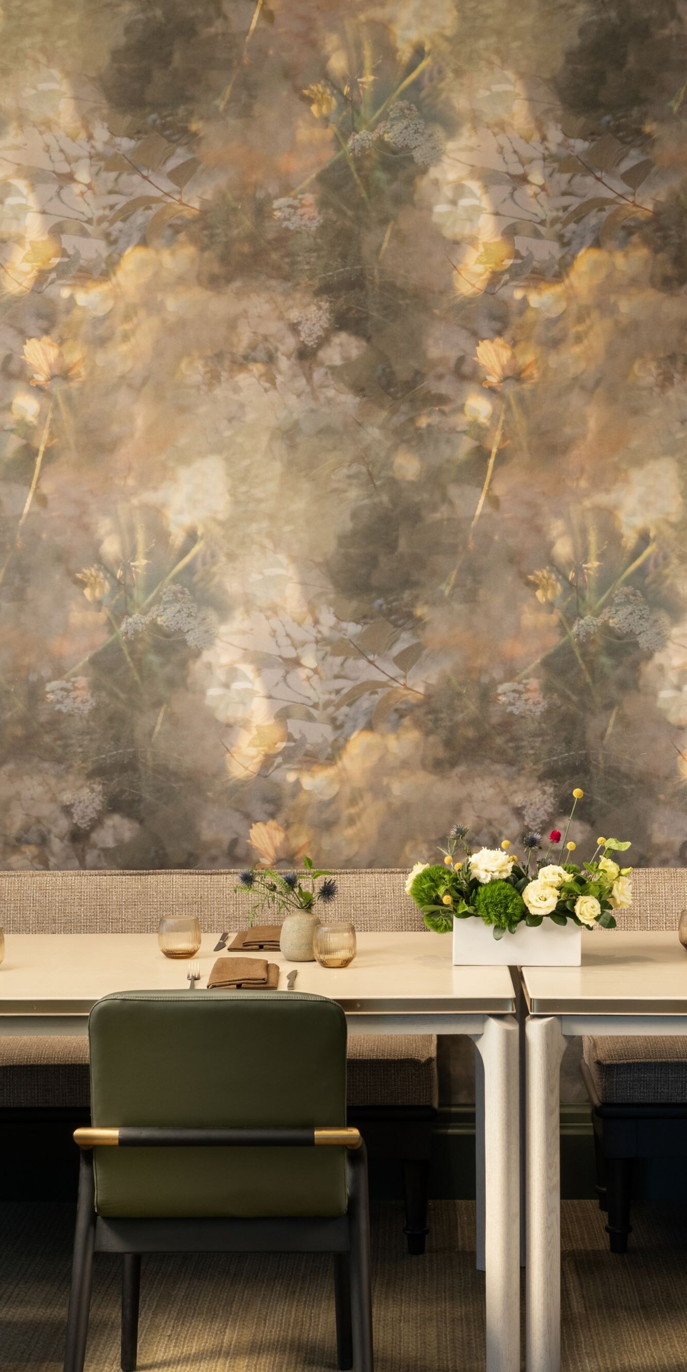 Private dining room with floral wallpaper.