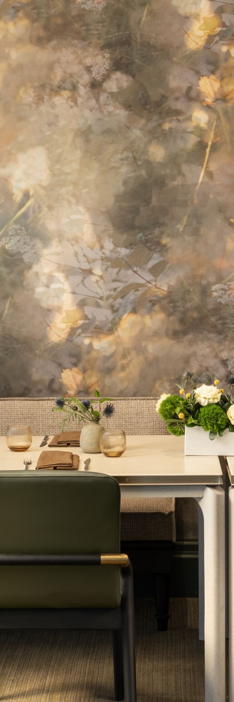 Private dining room with floral wallpaper.
