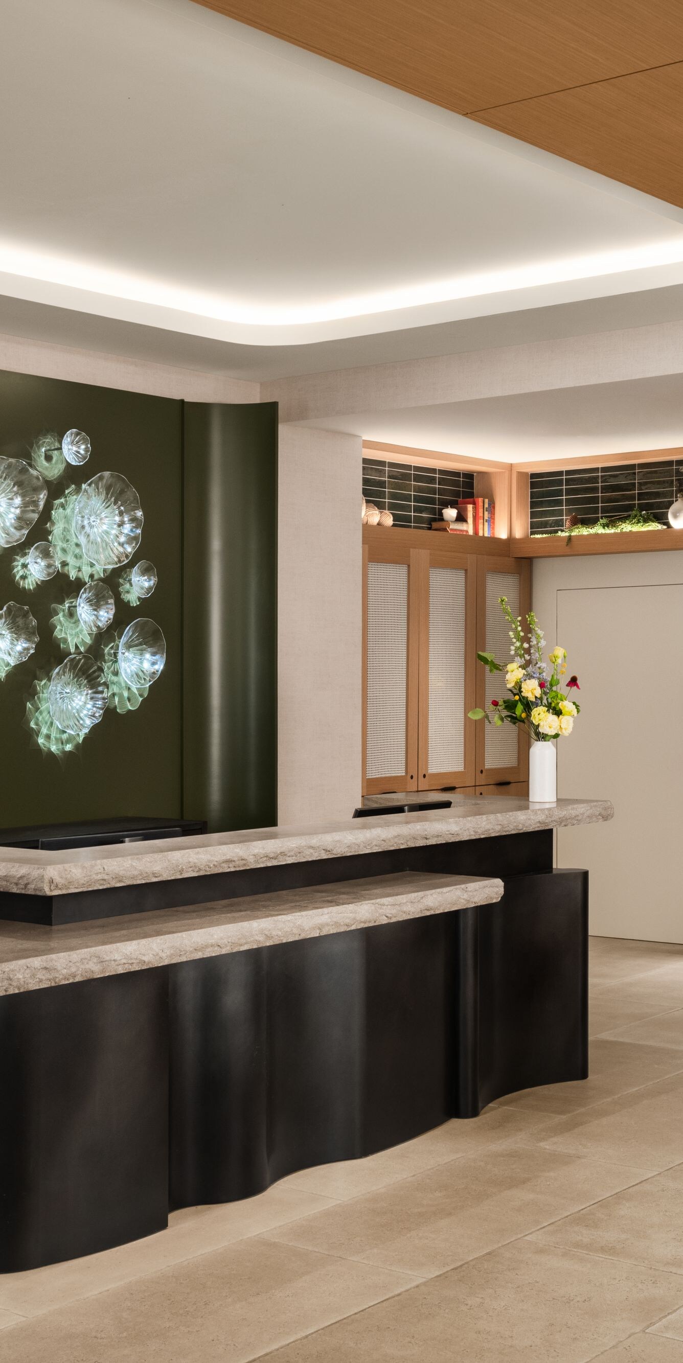 Reception desk and retail display with greenery