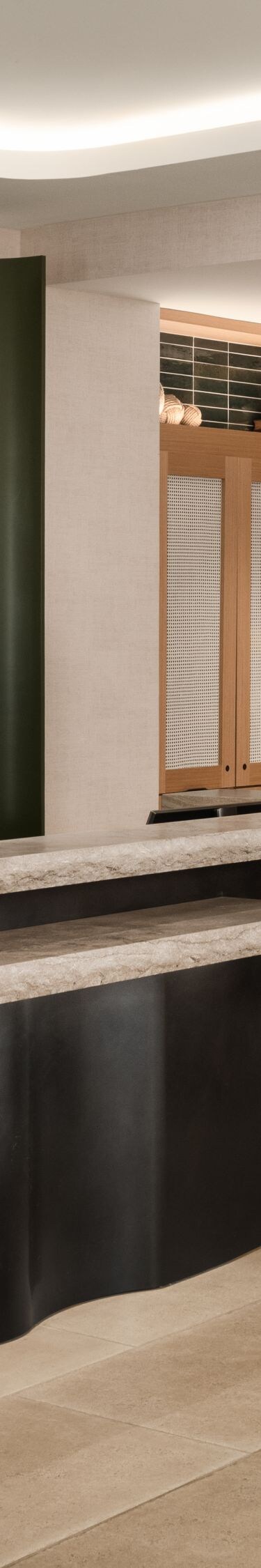 Reception desk and retail display with greenery
