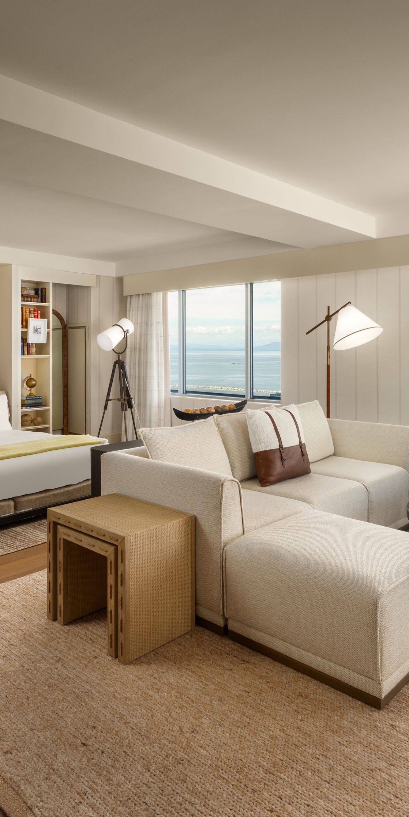 Murphy bed, bookshelves and seating with lake view
